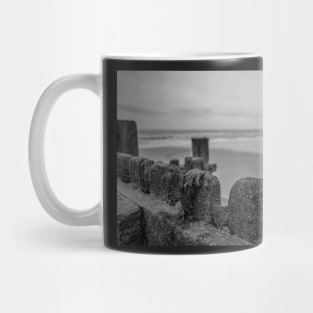 Close up of wooden sea defences protecting against coastal erosion Mug